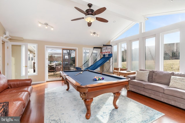 playroom with a wealth of natural light, vaulted ceiling with beams, billiards, and hardwood / wood-style flooring