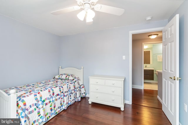 bedroom with dark hardwood / wood-style flooring and ceiling fan