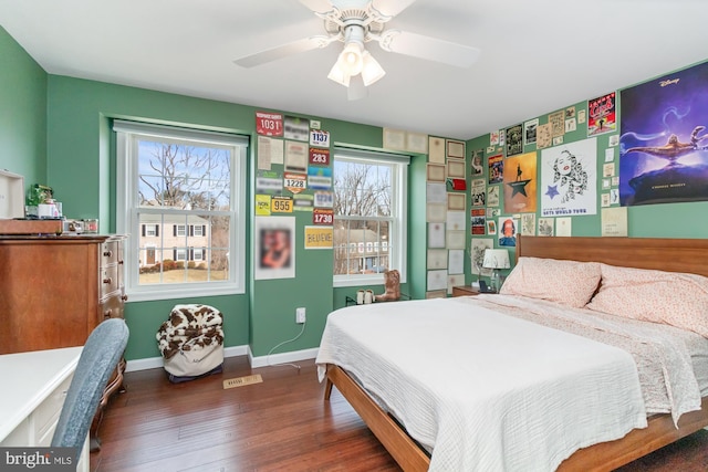 bedroom with ceiling fan and dark hardwood / wood-style floors