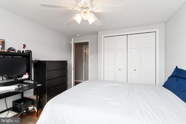 bedroom with hardwood / wood-style floors, a closet, and ceiling fan