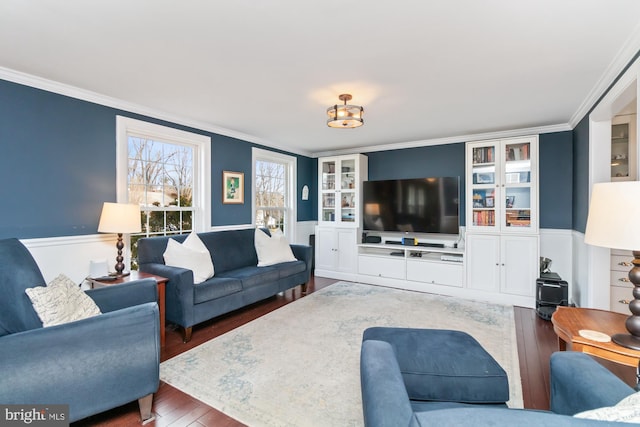 living room with ornamental molding and dark hardwood / wood-style floors