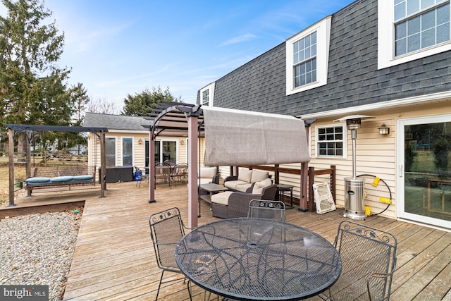 deck featuring a pergola and outdoor lounge area