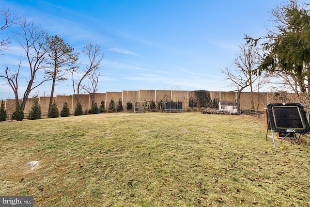 view of yard featuring a trampoline