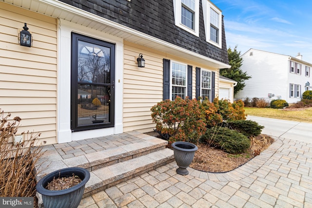 doorway to property featuring a garage