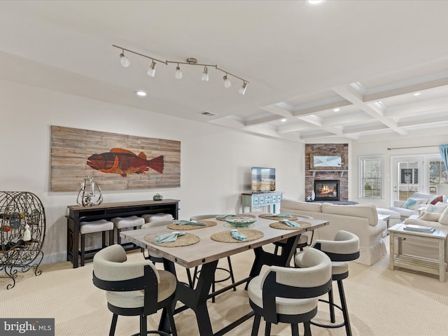 carpeted dining room featuring recessed lighting, a fireplace, coffered ceiling, visible vents, and beam ceiling