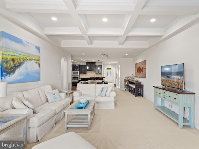 living area featuring light colored carpet, arched walkways, coffered ceiling, and beamed ceiling