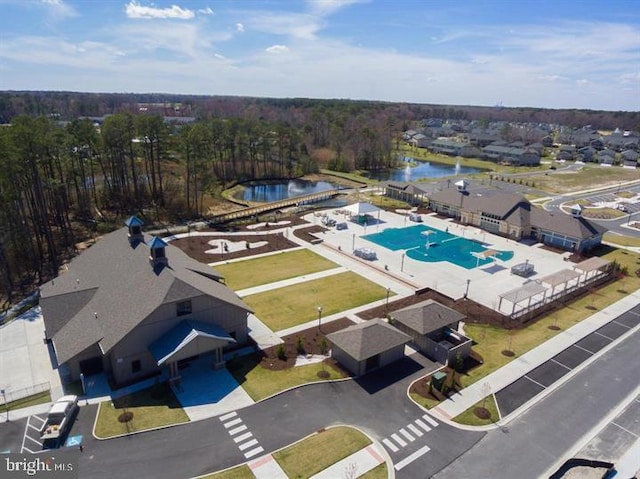 birds eye view of property with a water view