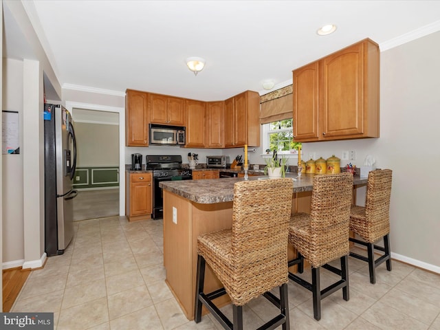 330 Mountaineers Way, Emmitsburg, MD 21727 - kitchen with appliances with stainless steel finishes, a peninsula, dark countertops, a breakfast bar area, and brown cabinetry