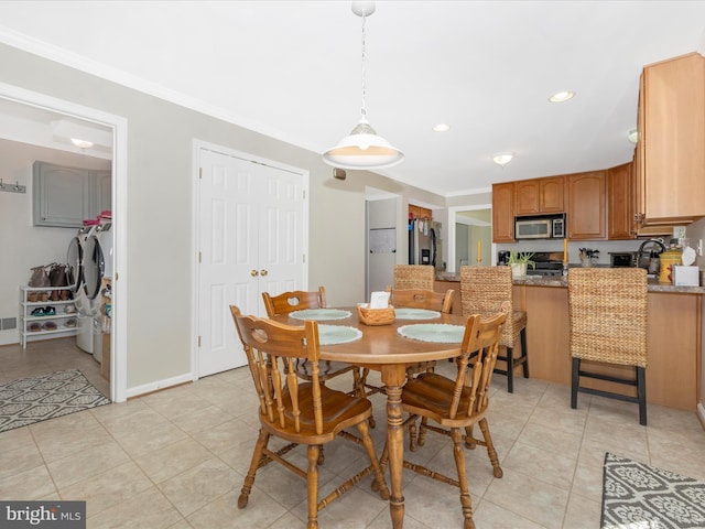 330 Mountaineers Way, Emmitsburg, MD 21727 - dining room featuring light tile patterned floors, crown molding, washer and dryer, and recessed lighting