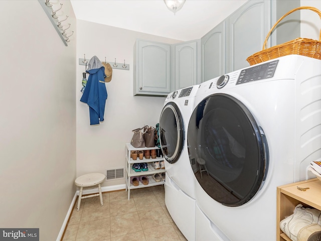 330 Mountaineers Way, Emmitsburg, MD 21727 - laundry area with cabinet space, separate washer and dryer, baseboards, and light tile patterned flooring