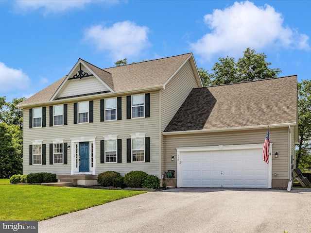330 Mountaineers Way, Emmitsburg, MD 21727 - colonial-style house featuring asphalt driveway, a garage, a front yard, and a shingled roof