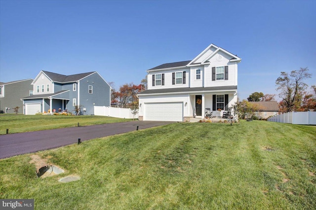 front of property featuring a garage, covered porch, and a front lawn