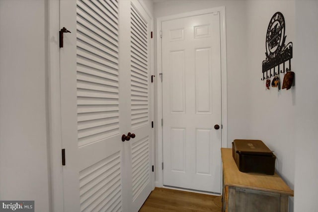 doorway with dark hardwood / wood-style flooring