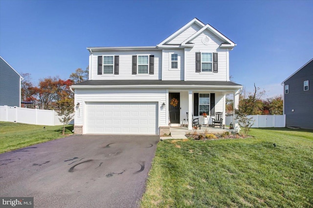 front of property with a garage, a porch, and a front yard