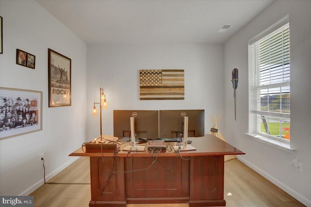 office with light hardwood / wood-style floors