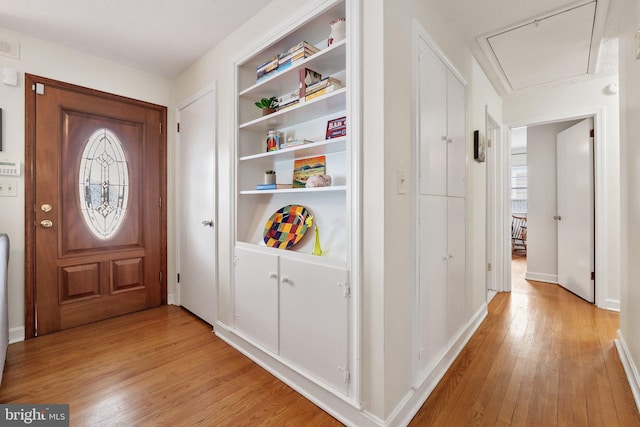 foyer with light hardwood / wood-style floors