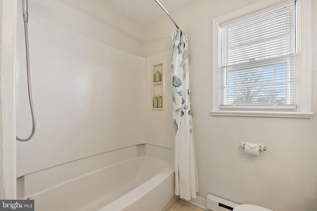 bathroom featuring a baseboard radiator and shower / bath combo