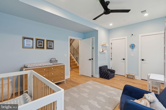 bedroom with ceiling fan and light wood-type flooring