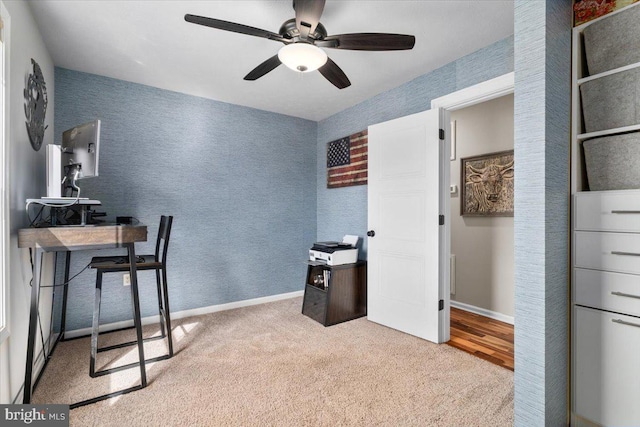 office with carpet floors, a ceiling fan, and baseboards