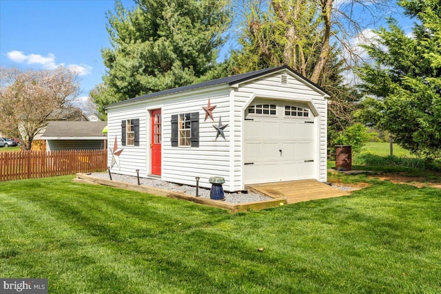 garage with fence