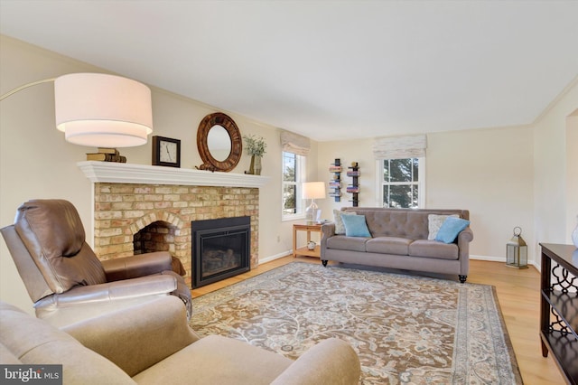 living room with a fireplace and light hardwood / wood-style floors