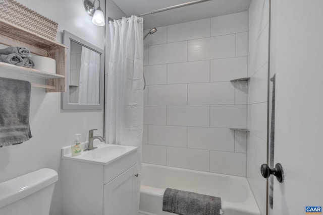 full bathroom featuring vanity, shower / bath combination with curtain, and toilet