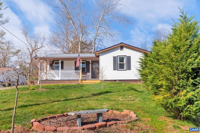 ranch-style home featuring a porch and a front lawn