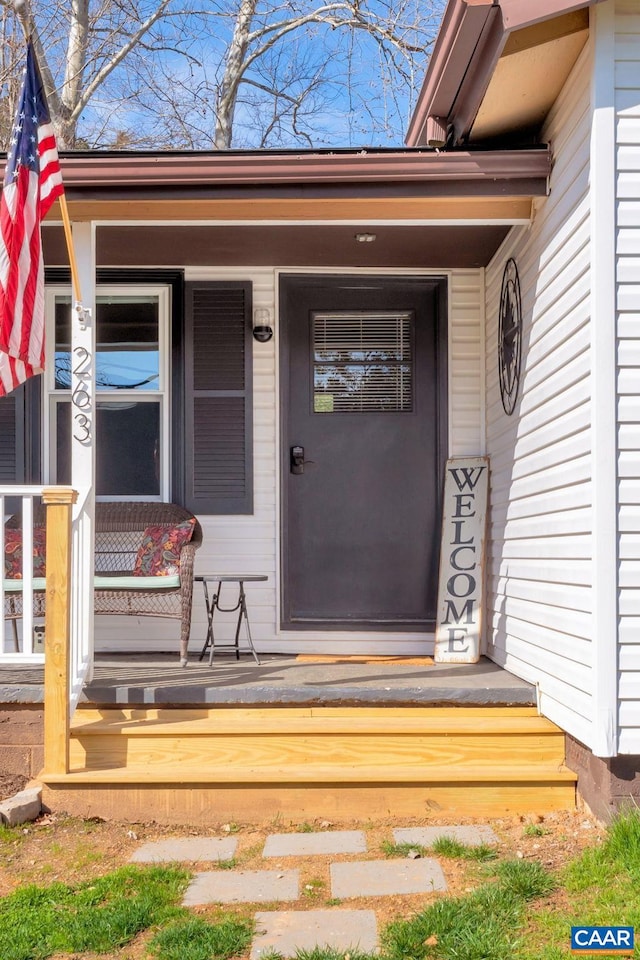 doorway to property featuring covered porch