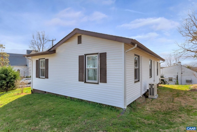 view of home's exterior with a yard