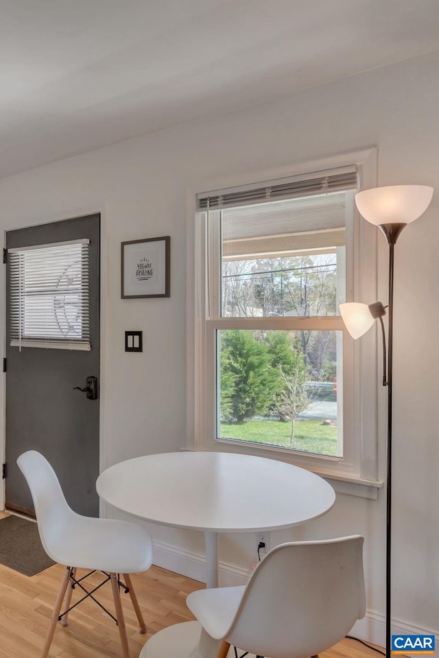 dining space with light hardwood / wood-style floors