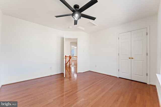 unfurnished bedroom with baseboards, ceiling fan, and light wood finished floors