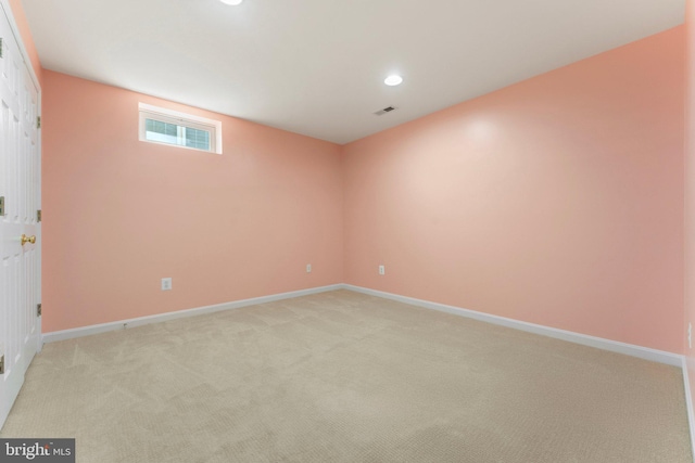 interior space featuring recessed lighting, light colored carpet, and baseboards