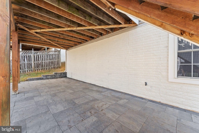 view of patio featuring fence