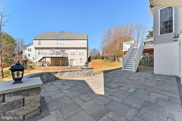 view of patio / terrace featuring stairway and a wooden deck