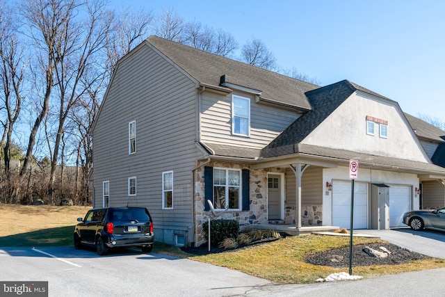 front facade featuring a garage and a porch