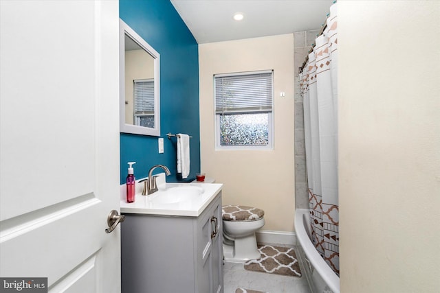 full bathroom with toilet, shower / bath combo with shower curtain, and vanity