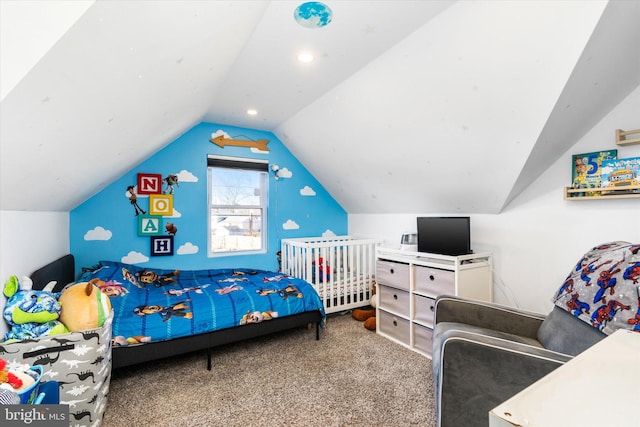 carpeted bedroom featuring lofted ceiling