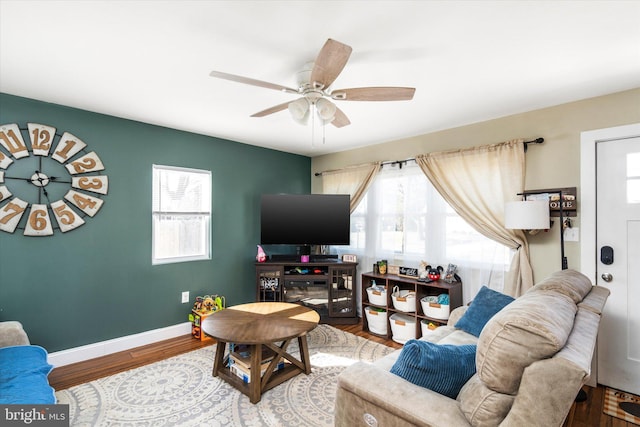 living room featuring plenty of natural light, ceiling fan, and hardwood / wood-style flooring