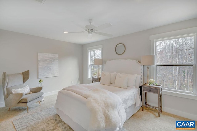 carpeted bedroom with ceiling fan