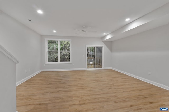 unfurnished room with ceiling fan and light hardwood / wood-style flooring