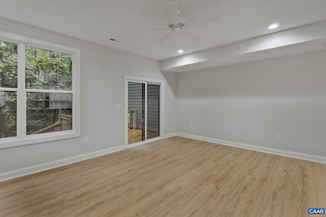 unfurnished room with ceiling fan and light hardwood / wood-style floors