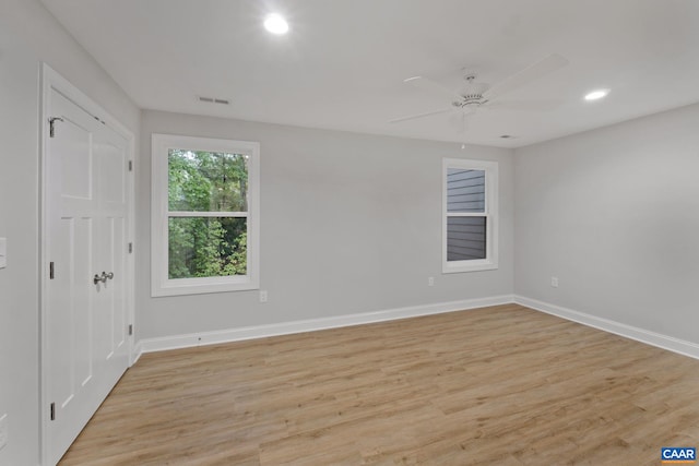 unfurnished room featuring ceiling fan and light hardwood / wood-style floors