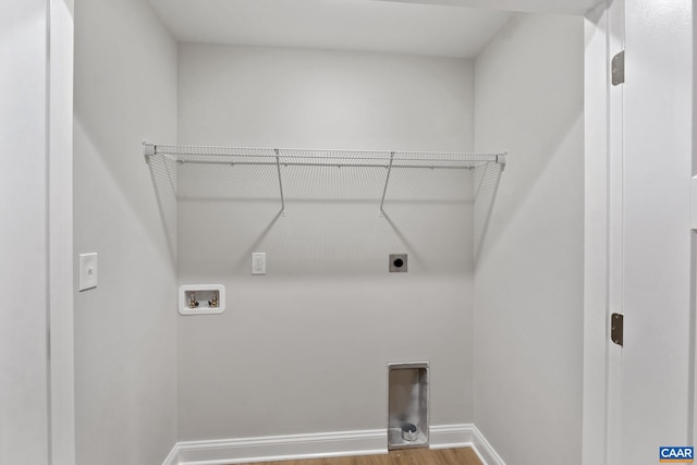 laundry area with hardwood / wood-style floors, hookup for a washing machine, and hookup for an electric dryer