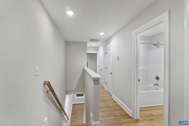 corridor featuring light hardwood / wood-style flooring