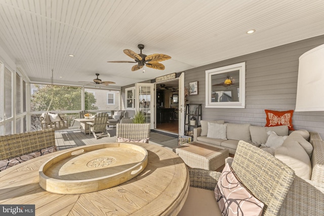 exterior space with outdoor lounge area, a deck, and ceiling fan