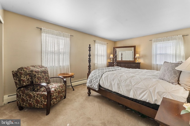 carpeted bedroom featuring a baseboard heating unit and multiple windows