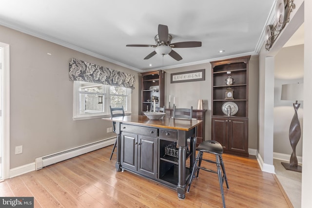 interior space featuring open shelves, ornamental molding, light wood-style floors, and a baseboard radiator