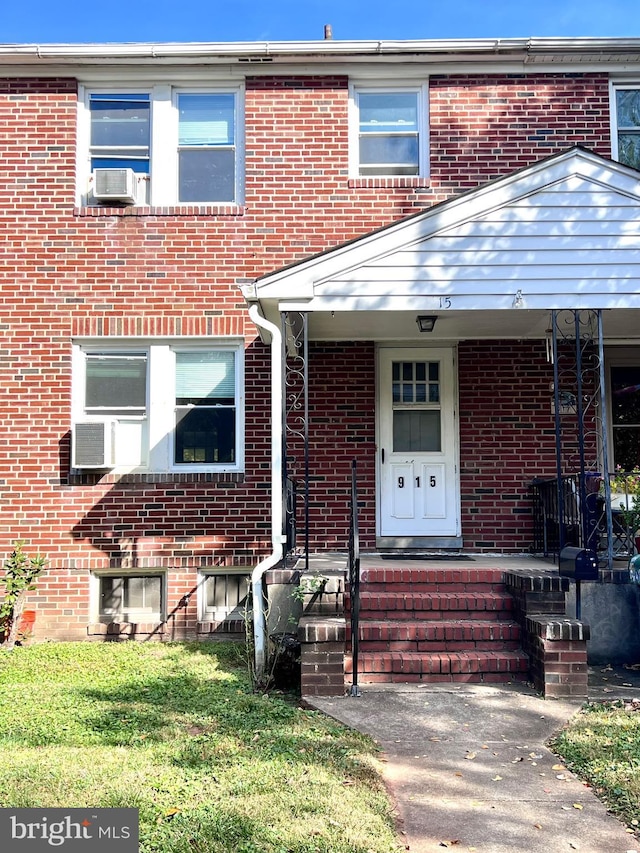 view of property featuring a front lawn