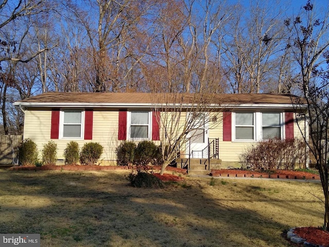 single story home featuring a front yard