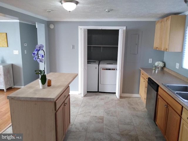 kitchen with dishwasher, washing machine and clothes dryer, light countertops, light brown cabinetry, and a sink